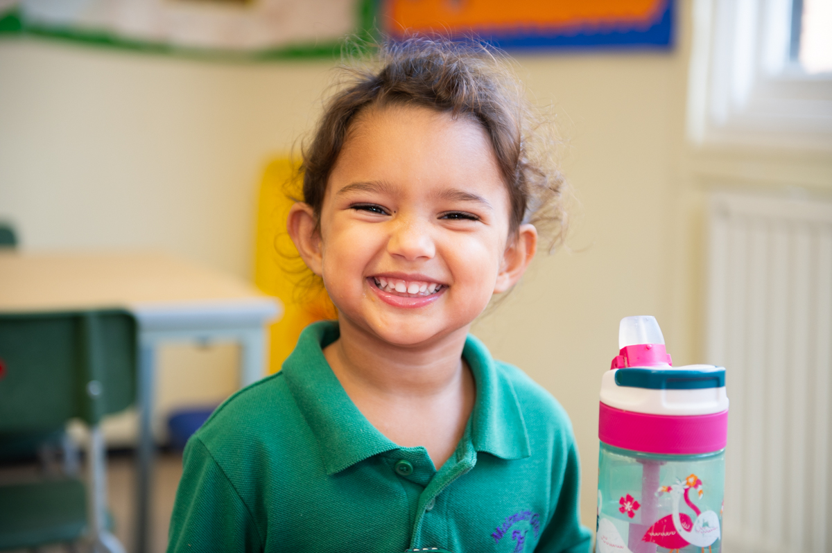 Little Malties' girl smiling in front of the camera