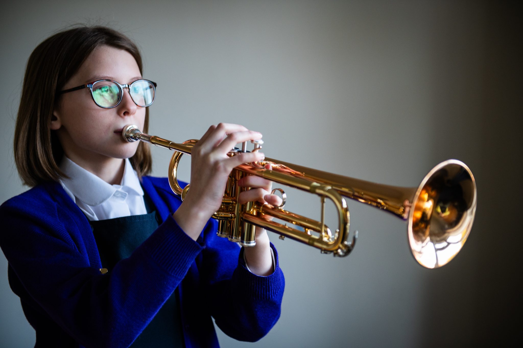 A student at a private school in Buckinghamshire playing an instrument.