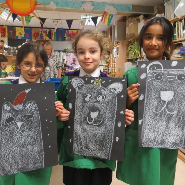 school girls with their chalk drawings of bears