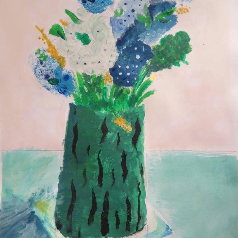 a painted vase with blue and white flowers