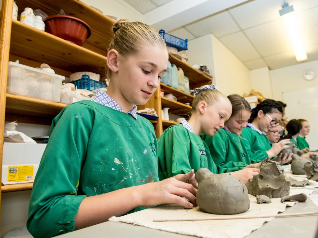 children working with clay