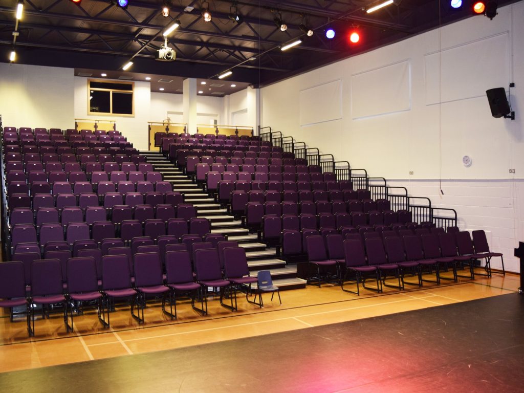 rows of purple theatre chairs