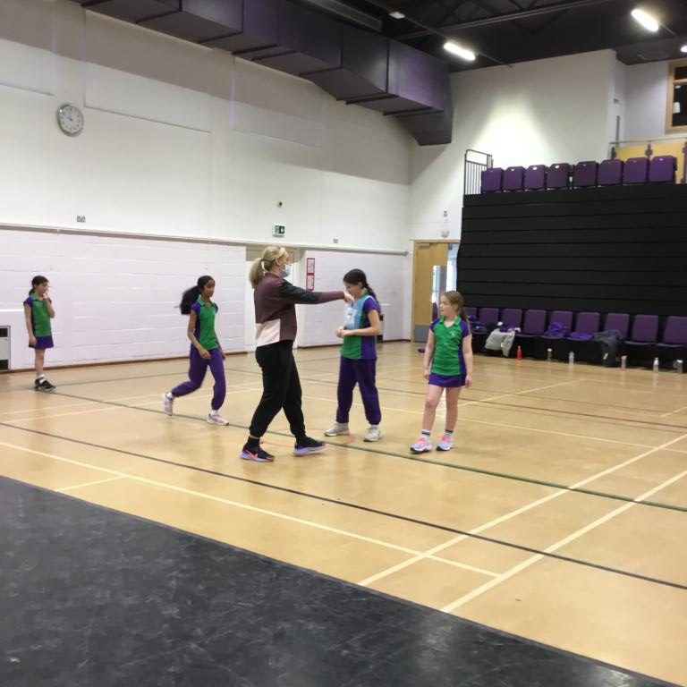 Students looking at netball practice